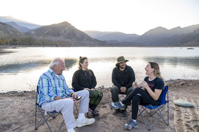 Family enjoying time together while relaxing outdoors in nature.