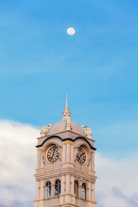 Low angle view of clock tower against sky