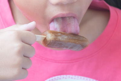 Close-up of woman eating food