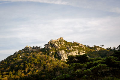 Low angle view of rocks against sky