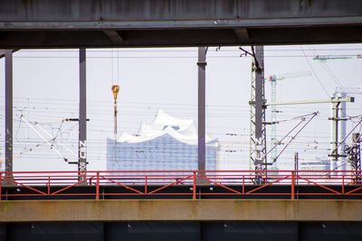 Elbphilharmonie by bridge against sky