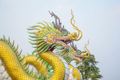Chinese dragon in the sky and incense holder - thai temple