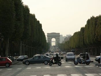 Cars on road against clear sky