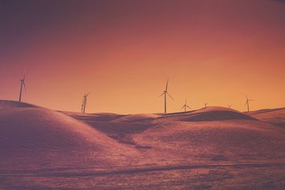 Scenic view of desert against sky during sunset