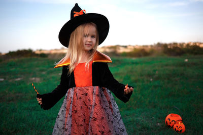 Full length of girl on grassy field