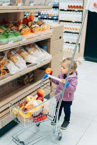 Girl having food in store