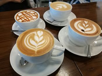 High angle view of cappuccino served on table