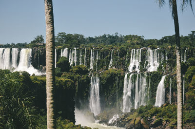 Scenic view of waterfall against clear sky