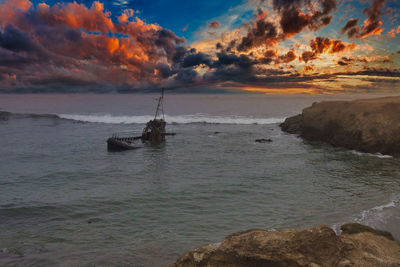 Scenic view of sea against sky during sunset