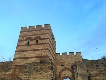 Low angle view of built structure against blue sky