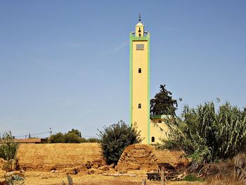Low angle view of clock tower against clear sky