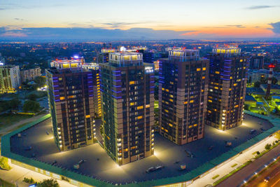 High angle view of illuminated buildings at night