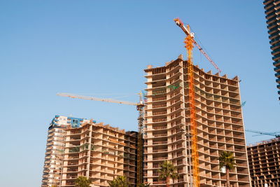 Low angle view of building against clear blue sky