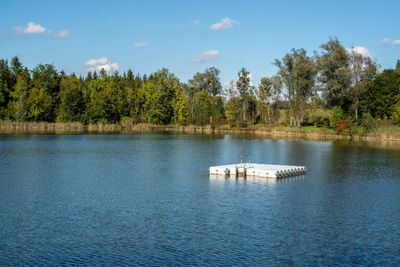 Scenic view of jumping platform on lake against sky