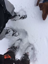 Low section of people on snow covered mountain