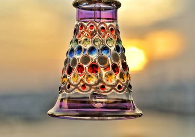 Close-up of multi colored glass on table