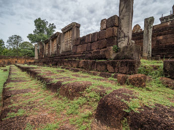 View of old building against cloudy sky