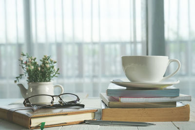 Coffee cup on table at home