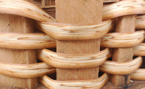 Texture of straw braided in wood, the details that is typical in being rigid in the straw baskets.s.