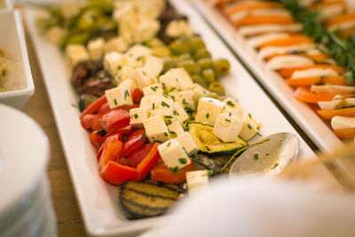 High angle view of chopped vegetables in plate on table