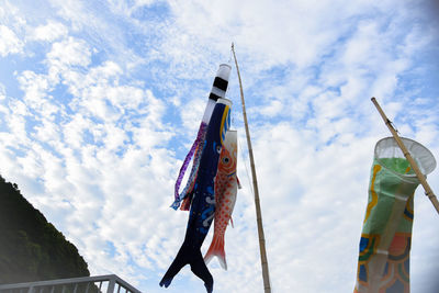 Low angle view of flag against sky