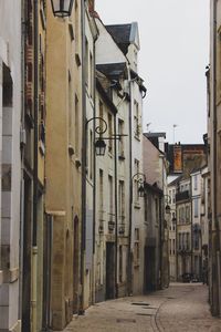 Street amidst buildings against sky