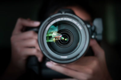 Close-up of hand holding camera