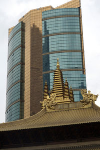 Low angle view of statue against sky