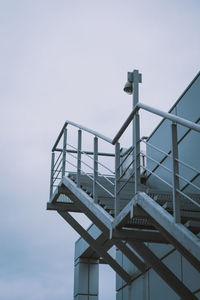 Low angle view of steps against clear sky