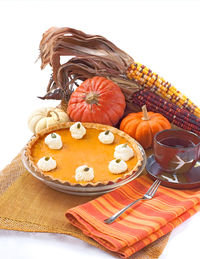 Various fruits on table against white background