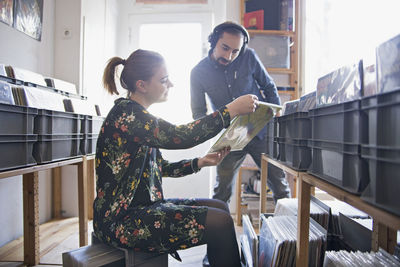 Young couple shopping for records together