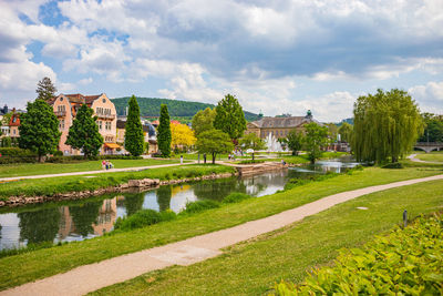 Scenic view of lake against cloudy sky