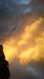 Low angle view of cloudy sky at sunset