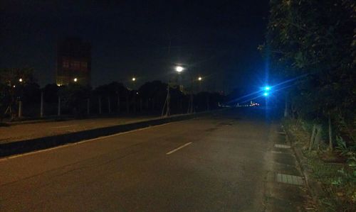 Street lights on road at night