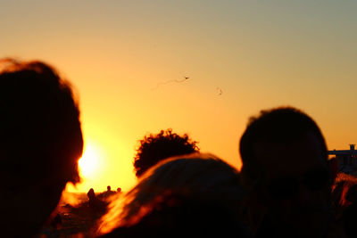 Silhouette people at sunset