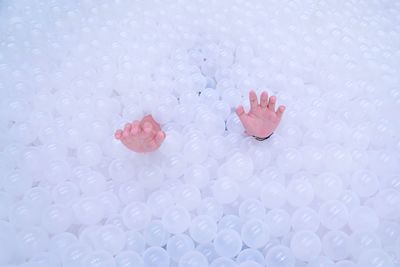 Low section of person on white surface