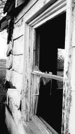 Man seen through window of old building