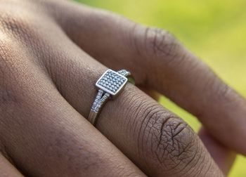 Close-up of couple holding hands