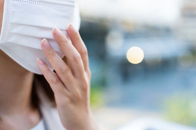 Midsection of woman reading book