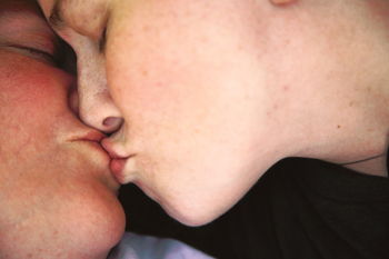 Close-up of lesbian couple kissing