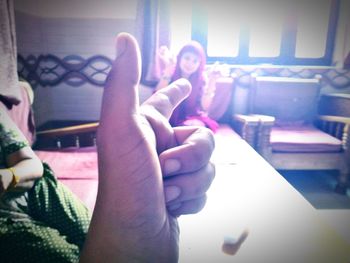 Rear view of a young man sitting on bench