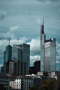 Skyscrapers in city against sky