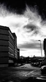 City street against cloudy sky