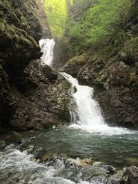 Scenic view of river flowing through rocks