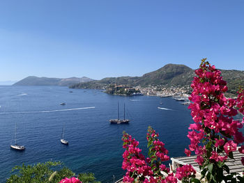 Scenic view of sea against clear blue sky