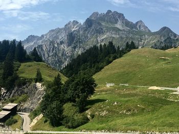 Scenic view of landscape and mountains against sky