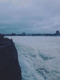 Scenic view of sea against cloudy sky