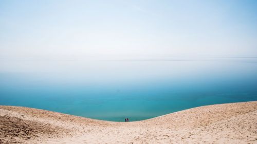 Sand dune with sky in background