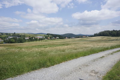 Scenic view of agricultural field against sky