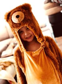 Portrait of boy in teddy bear costume